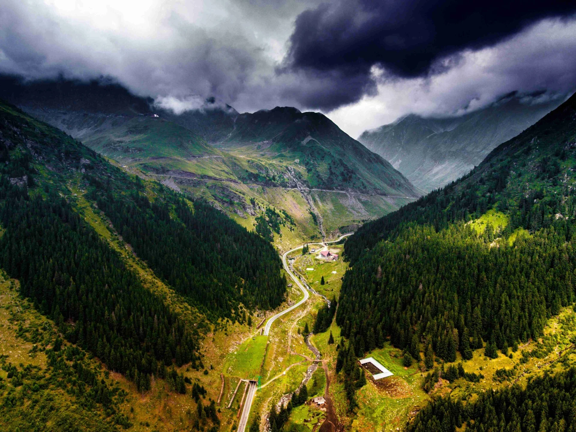 Dramatic Mountain Valley With Storm Clouds 1mD4NhA scaled