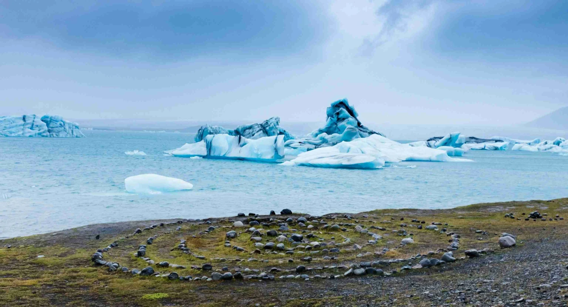 Icebergs and Mountain Reflections in Glacial Lagoon