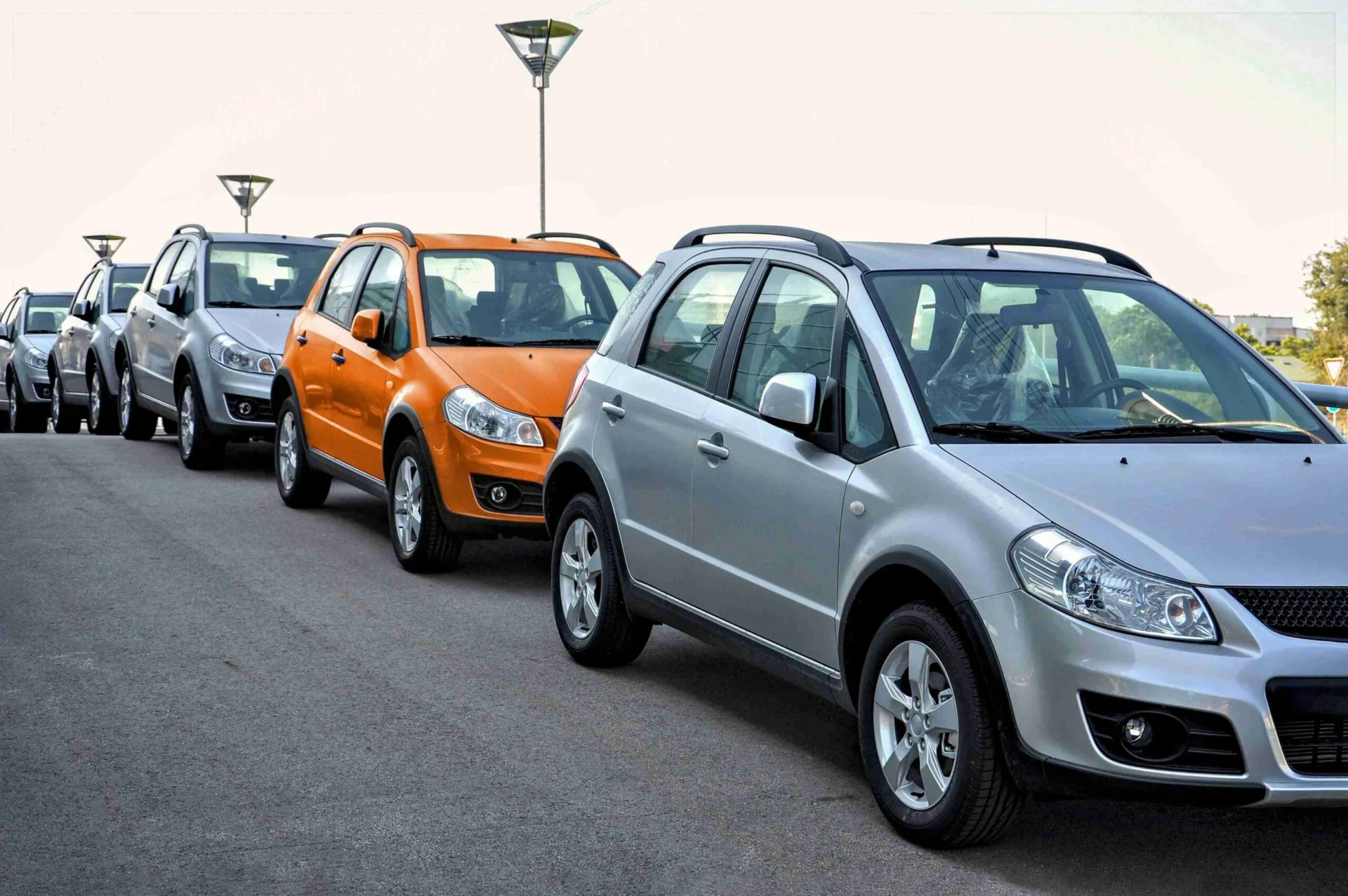 orange colored car in the gray car line concept a 2023 11 27 05 16 49 ut v02klhS scaled