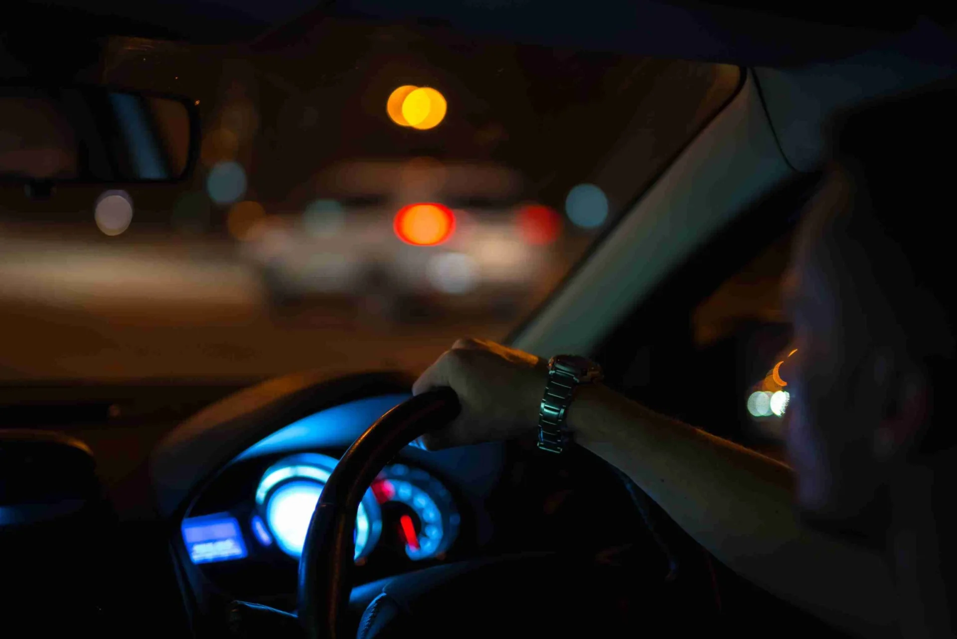 Woman driver using smartphone while driving