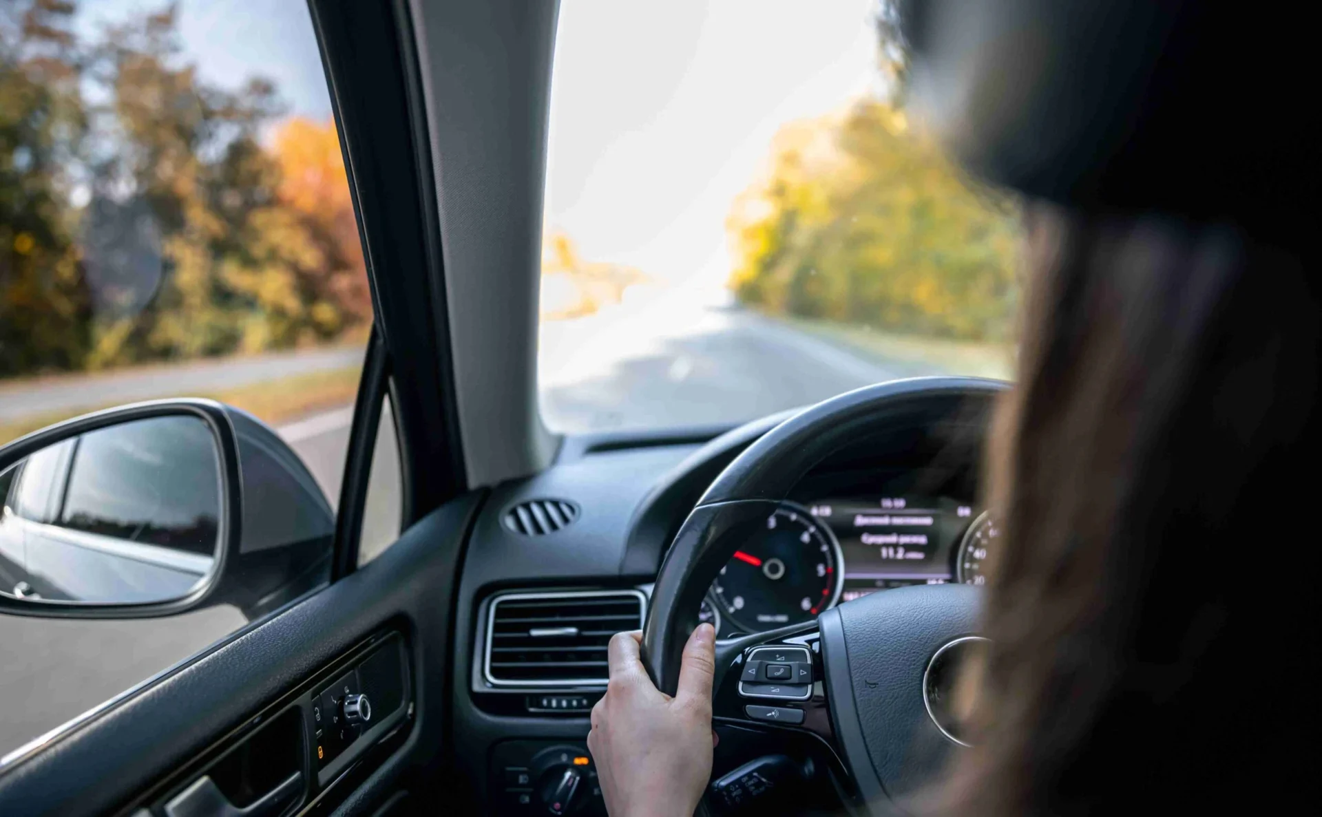 woman driver s hands on the steering wheel inside 2023 11 28 04 14 50 ut 6CD2YfL scaled