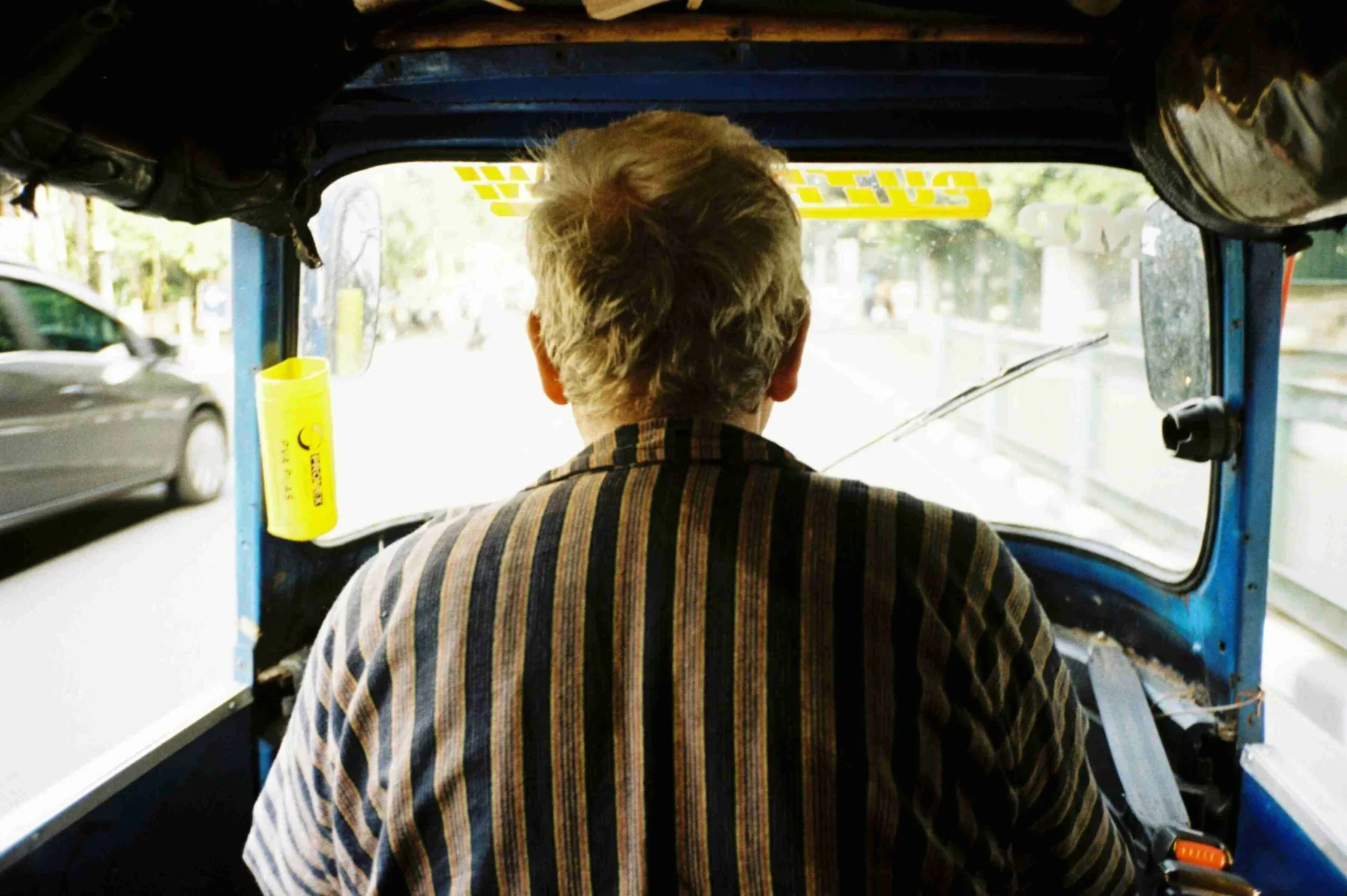 a person sitting in a green van