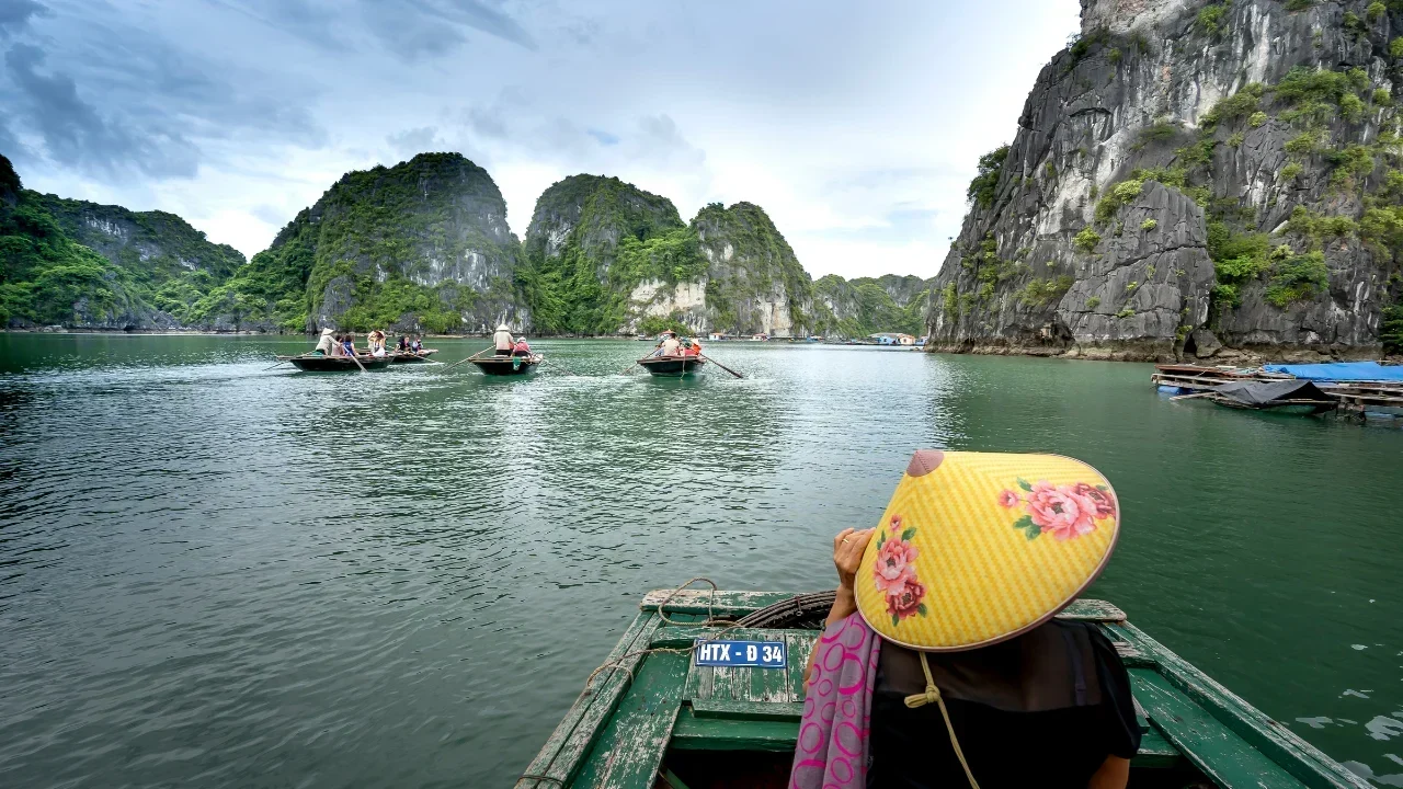 "Traditional Vietnamese Temple on Stilts Over Water"