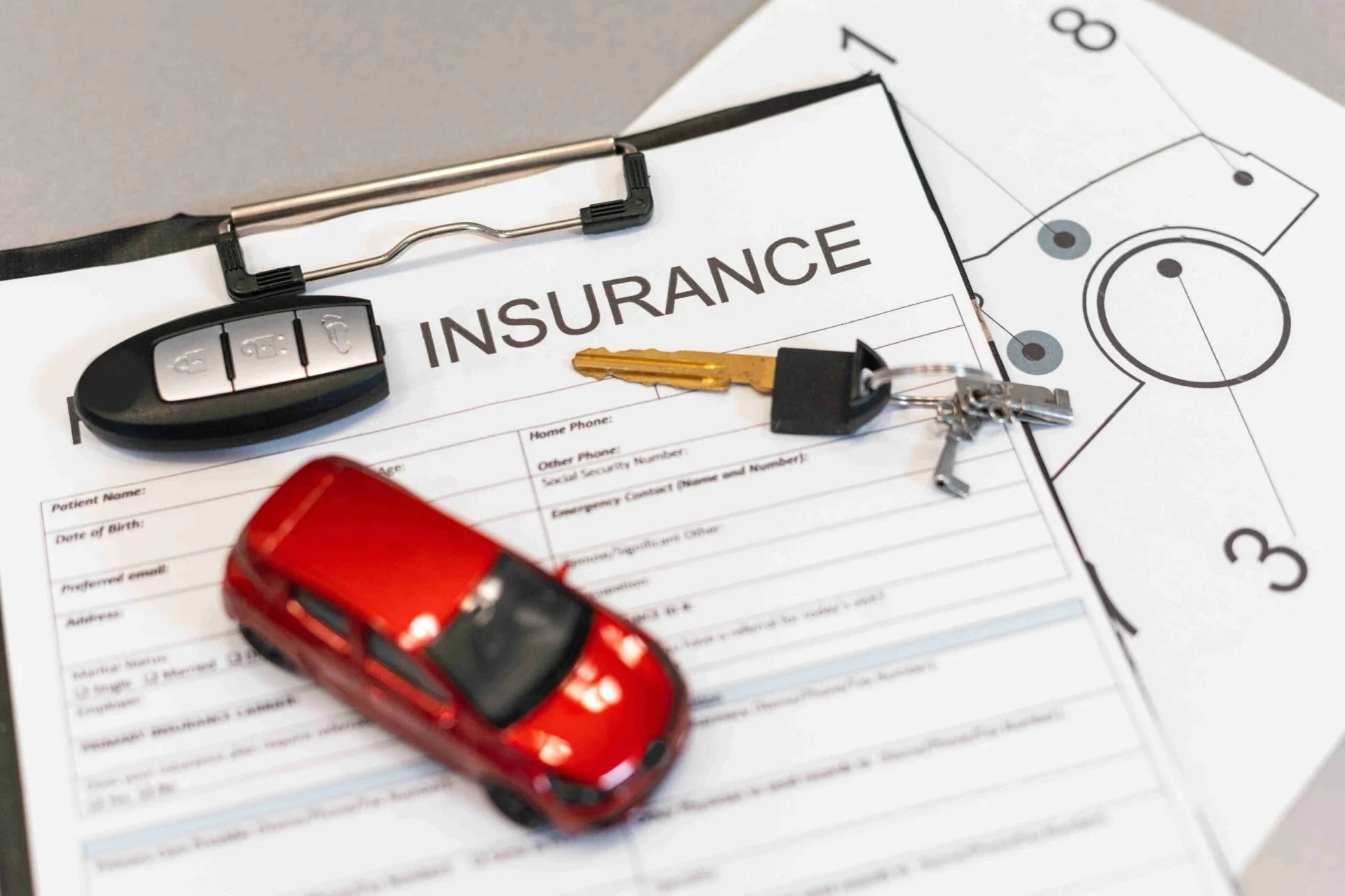 person using a laptop device to access an online car insurance platform