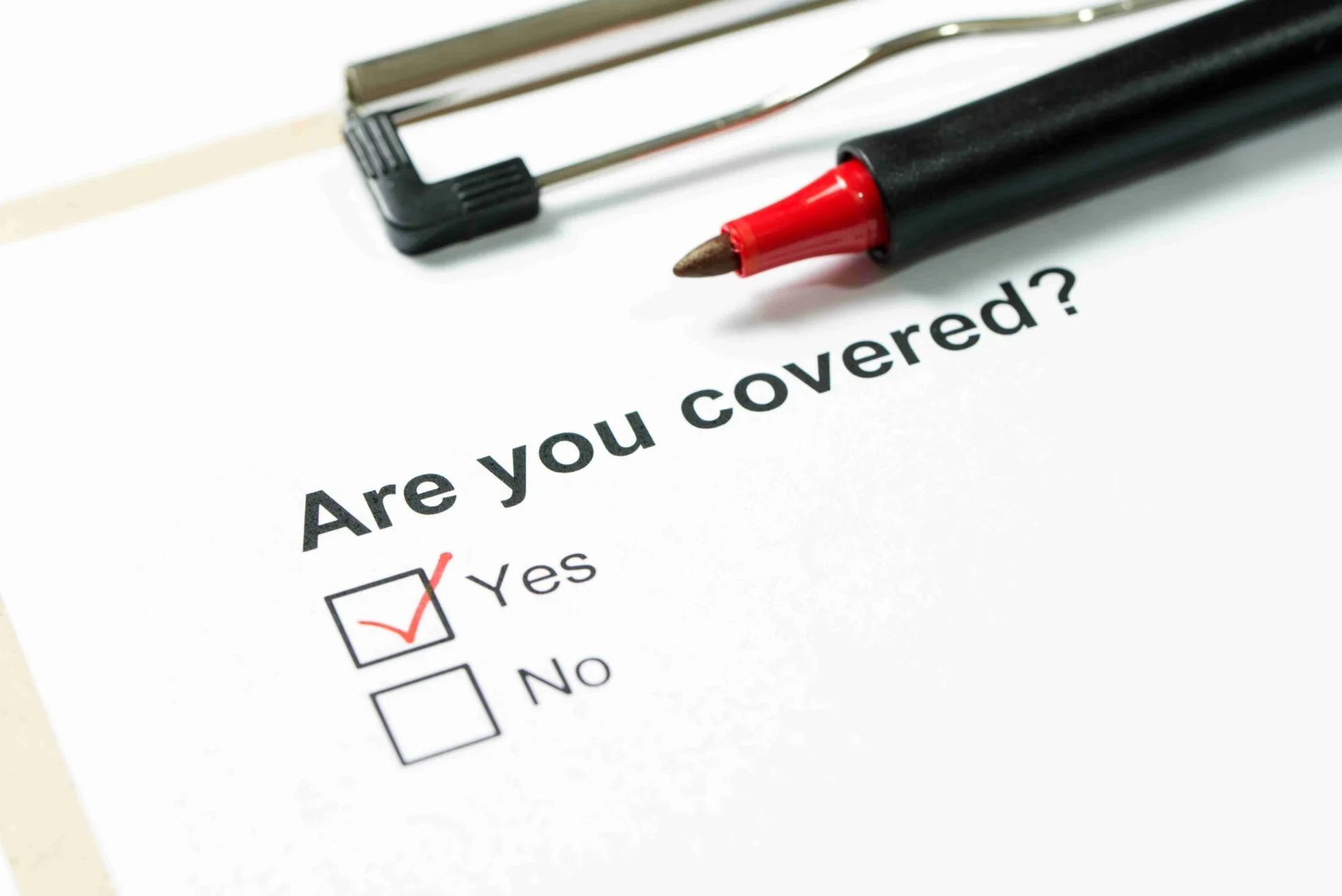 Flat lay of vehicle insurance policy