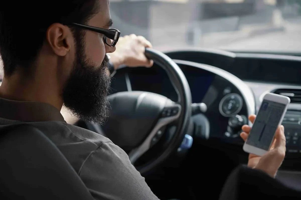 man-using-mobile-phone-while-dri man using mobile phone while dri